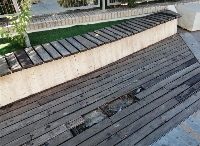 Mobiliario urbano deteriorado o ausente, contenedores inservibles, señales de tráfico y rótulos de calles descoloridos